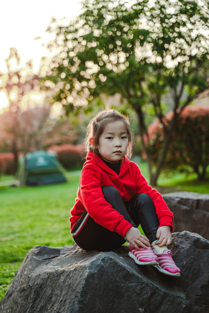 casual clothing, tree, leisure activity, contemplation, plant, person, females, human, clothing, shoe, lifestyles, childhood, sitting, lawn, grass, sphere