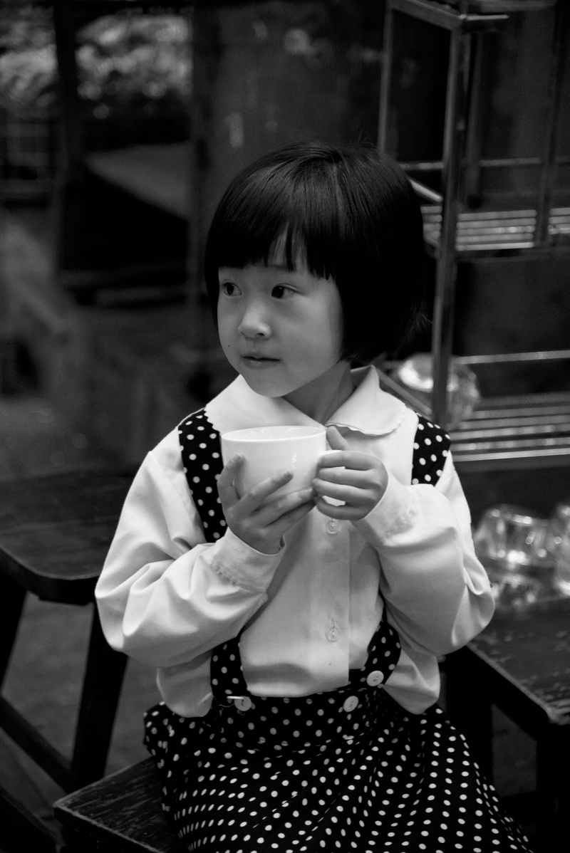 food, person, standing, girls, pretty, cup, grayscale, latte, females, kids, skirt, real people, finger, waist up, drink, photography, dish, hairstyle