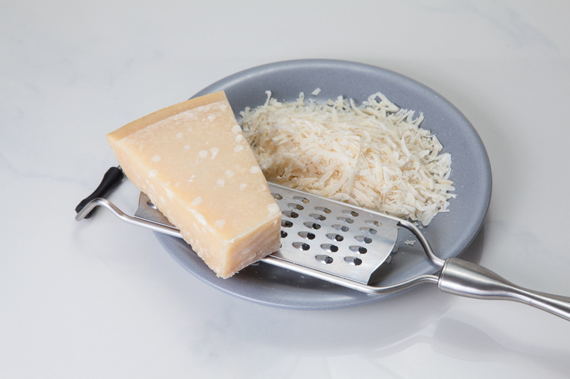 spoon, studio shot, household equipment, cheese, food and drink, colored background, cheese grater, plate, kitchen, rasp cheese, parmesan, steel, pasta