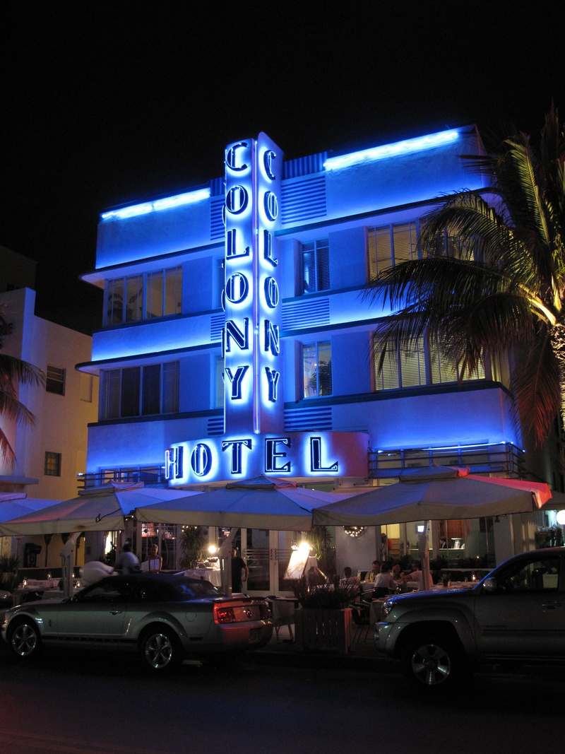 motor vehicle, nightlife, night, ocean drive, text, car, luxury, built structure, communication, western script, neon, travel, arts culture and entertainment