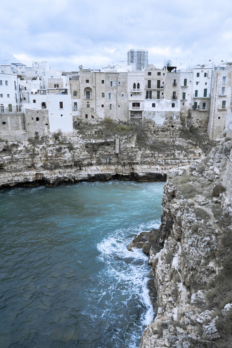 dramatic skies, tourism, promontory, cliffs, rock, puglia, cliff, polignano a mare, architecture, wave, www.maxlibertine.com, day, building, italy, sea