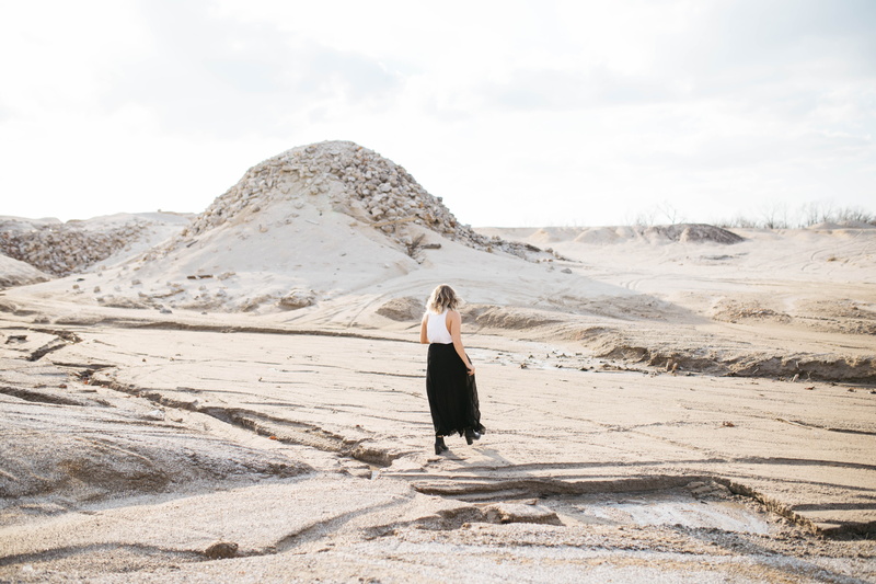 standing, woman, clothing, adult, #blonde, one person, person, skirt, nature, young women, lifestyles, desert, dress, landscape, walking, mound, #journey