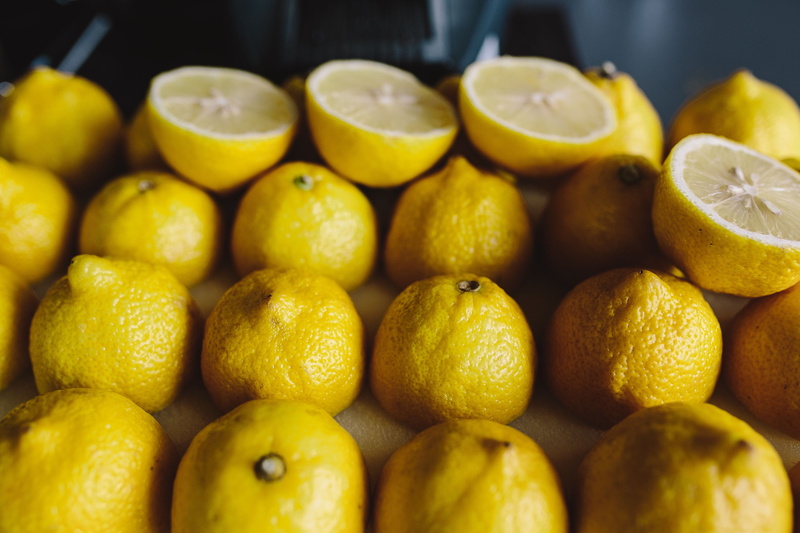 for sale, retail, large group of objects, market stall, Fresh, halved, lemons, yeallow, indoors, abundance, orange, lemon, wellbeing, fruit, freshness