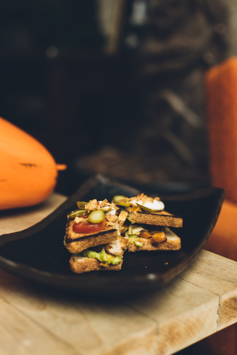sandvich, banana, sandwich, ceramic, french toast, indoors, vegetable, bread, food, apparel, mobile, branch, still life, toast, table, plate, wellbeing