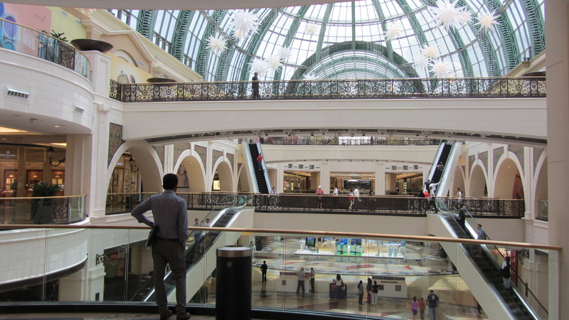 inside, modern, bridge, people, men, rear view, window, skywalk, built structure, indoors, the glass ceiling, ground, railing, leisure activity, man, architecture