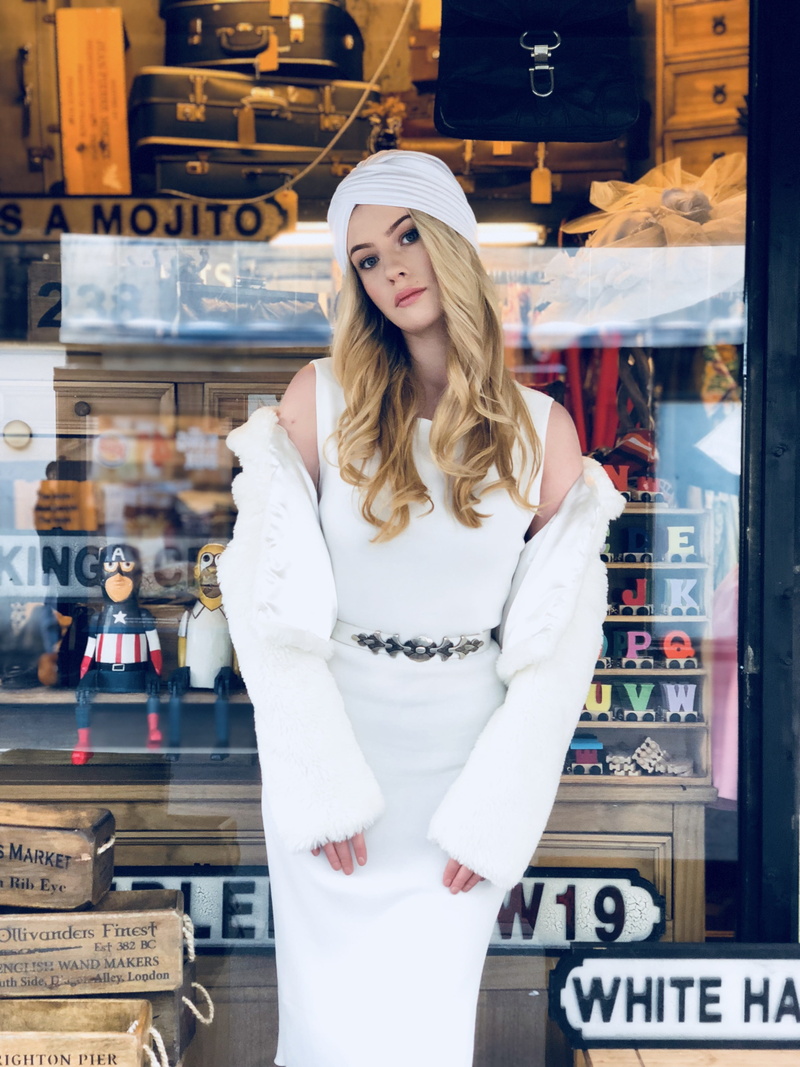 portrait, sale, hair, female, one person, consumerism, turban, adult, people, retail, looking at camera, clothing, beautiful woman, blond hair, store, lifestyle