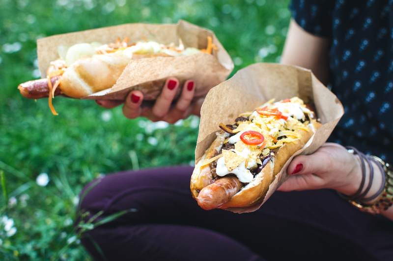 adult, women, holding, Hot dog, freshness, bread, hot, take out food, meat, outdoors, people, snack, human body part, human hand, sandwich, day, real people