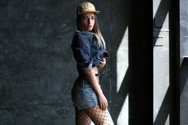 2K, denim, young adult, portrait, looking, young women, leisure activity, standing, jeans jacket, hat, wall - building feature, jean shorts, day, casual clothing