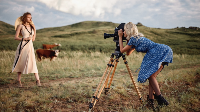 depth of field, cow, field, fishnet stockings, blonde, model, outdoors, vintage, tripod, 1080P, Georgy Chernyadyev, camera, boots, blue dress, dress, two women