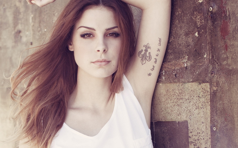 long hair, looking at camera, face, armpits, singer, tank top, wall, lifestyles, front view, looking at viewer, young adult, model, portrait, casual clothing