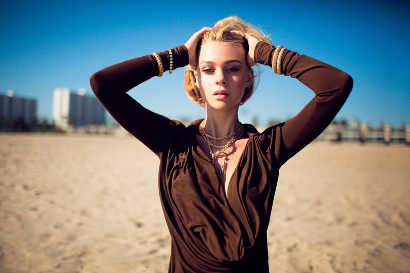 beautiful woman, hair, one person, nicola peltz, looking at camera, standing, human arm, outdoors, adult, sky, day, beach, young adult, beauty, portrait
