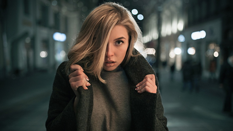 blonde, hairstyle, grey coat, blond hair, women outdoors, black coat, city, hair in face, city life, beauty, casual clothing, beautiful woman, emotion