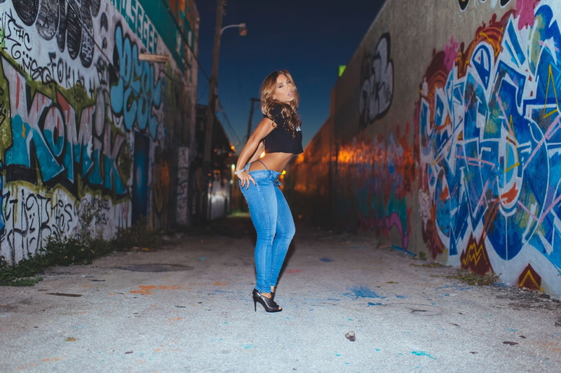 art and craft, wall - building feature, street art, city, standing, paint, architecture, creativity, real people, lifestyles, nicole mejia, graffiti, young adult