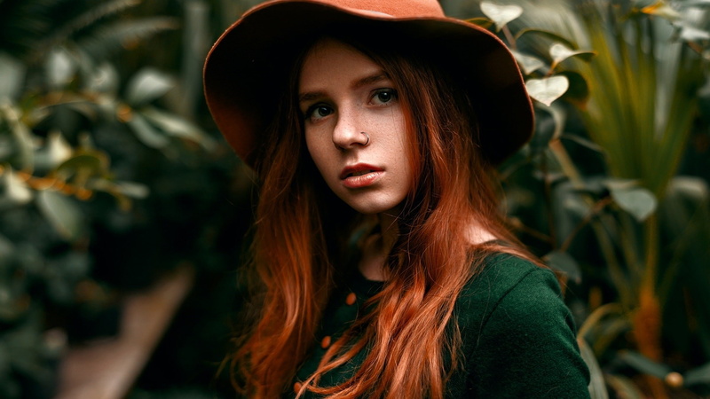 clothing, face, day, looking at camera, teenager, looking at viewer, young adult, hair, adult, headshot, model, plant, beauty, millinery, one person, contemplation
