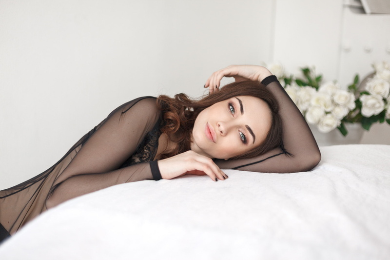 young women, one person, brown hair, bed, lying down, relaxation, women, leisure activity, hair, furniture, flower, beauty, portrait, looking at camera