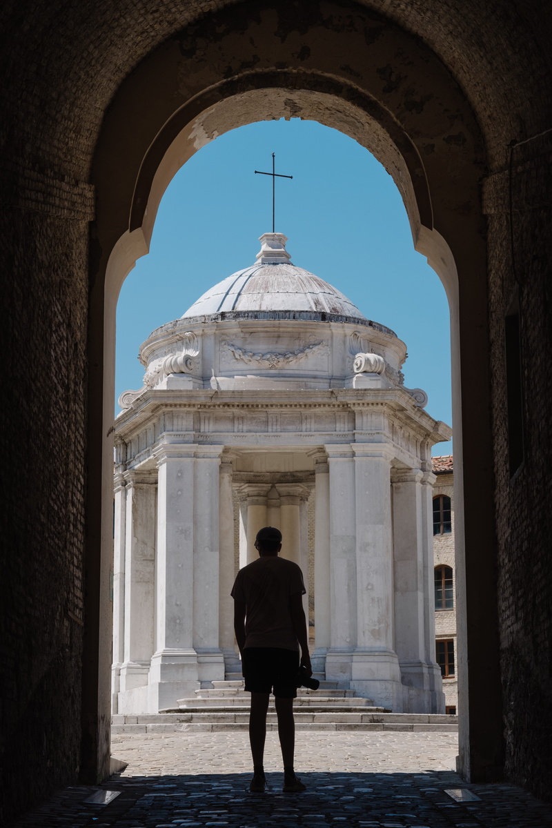 blue, building exterior, walking, standing, architecture, built structure, real people, patio, one person, day, young adult, near, dome, human, architectural column