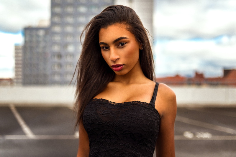 Miro Hofmann, built structure, 1080P, depth of field, real people, brown hair, one person, looking at camera, beauty, building, building exterior, fashion