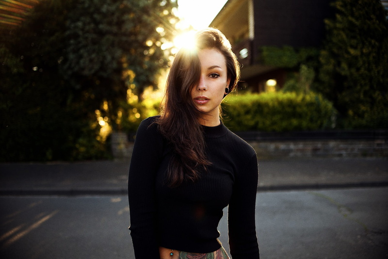 focus on foreground, piercing, one person, hairstyle, depth of field, smiling, tree, outdoors, young women, young adult, lifestyles, women outdoors, long hair