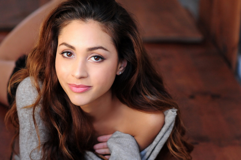 sweater, Lindsey Morgan, body part, beautiful people, long hair, young adult, adult, brown eyes, women, lying on front, beauty, one person, brunette, brown hair