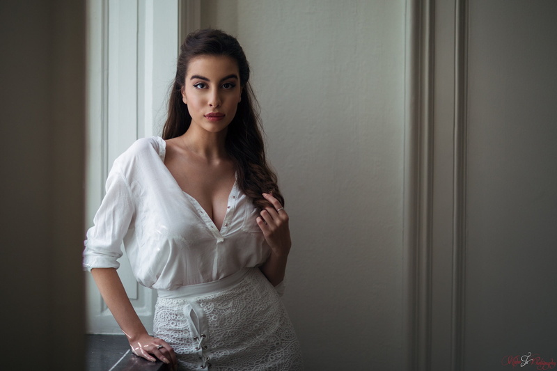 long hair, confidence, beautiful woman, hairstyle, young adult, skirt, women, adult, eyeliner, fashion, front view, cleavage, young women, beauty, indoors