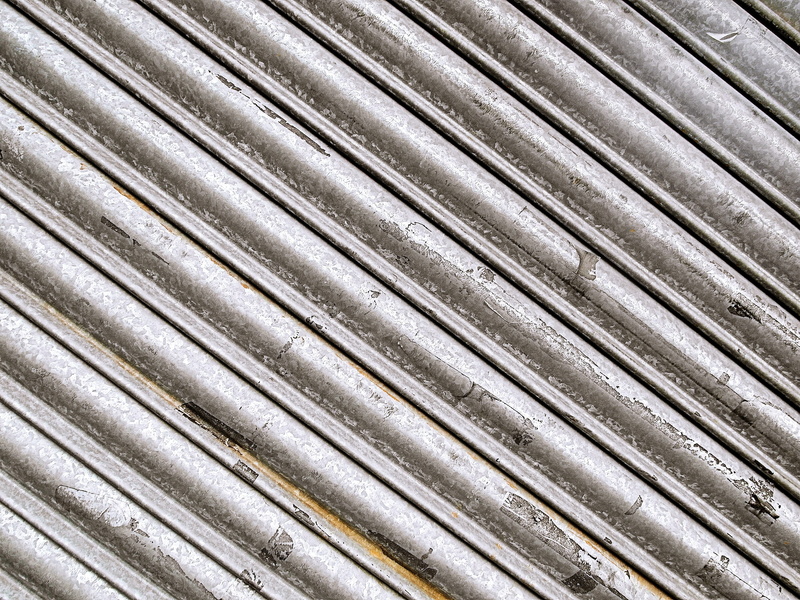 in a row, iron, coat, label, tar, female, abstract, spandex, silver colored, close-up, text, face, weathered, railing, slate, day, no people, backgrounds