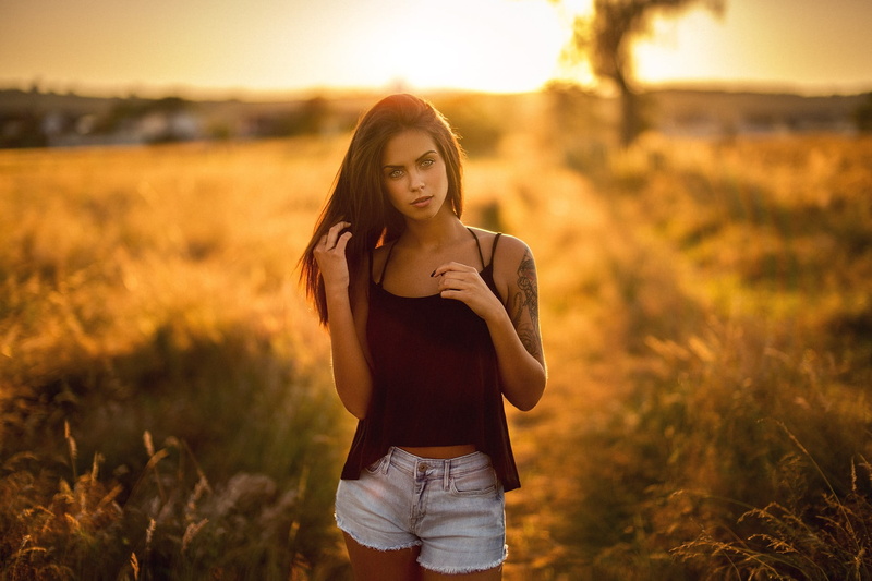 brunette, jean shorts, casual clothing, land, long hair, field, grass, sky, beauty, 1080P, tattoo, hairstyle, outdoors, women, portrait, young adult, leisure activity