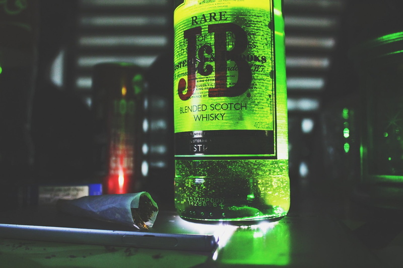 indoors, script, Justerini and Brooks, close-up, green color, no people, transparent, number, bottle, still life, non-western script, focus on foreground