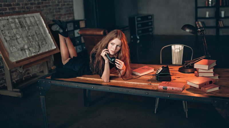 contemplation, business, hair, young adult, working, adult, indoors, telephone, technology, blond hair, table, one person, legs up, hairstyle, beautiful woman