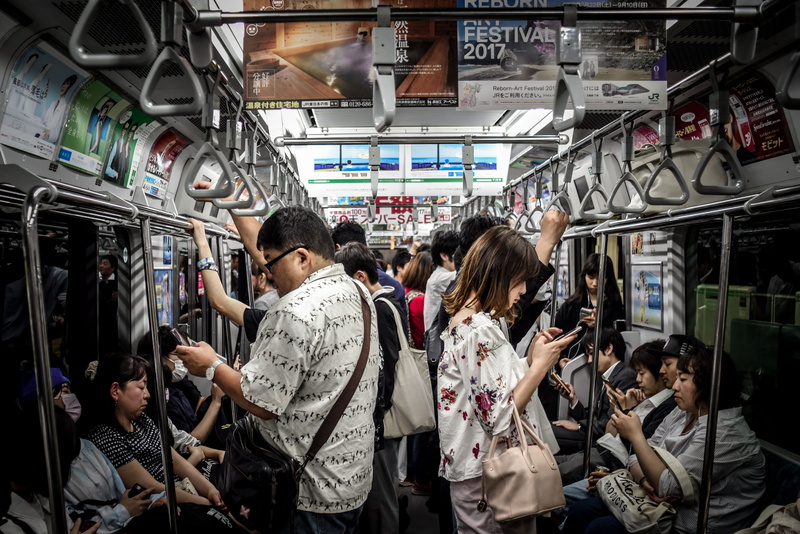 group of people, real people, indoors, transportation, bus, buying, phones, phone, consumerism, rail transportation, retail, market, commuter, people, shopping