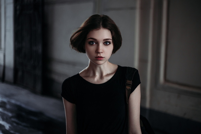 one person, fashion, dark, front view, black color, headshot, beautiful woman, beauty, hairstyle, looking at camera, focus on foreground, contemplation