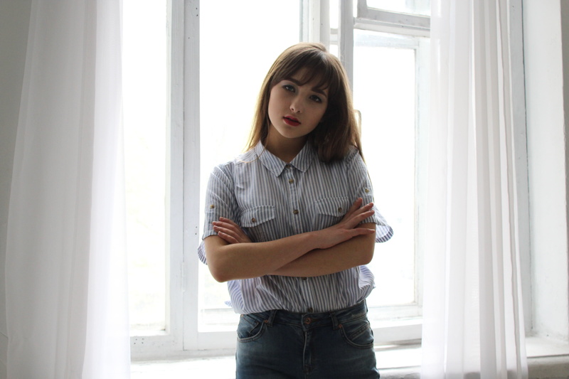 wall, near, standing, arms crossed, black, wearing, one person, indoors, only women, three quarter length, white, hairstyle, one woman only, real people