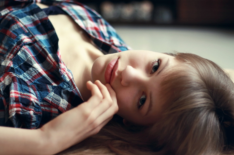 childhood, hair, face, one person, lies, furniture, close-up, women, indoors, eyes, girl, cute, body part, lifestyles, looking at camera, white, plaid