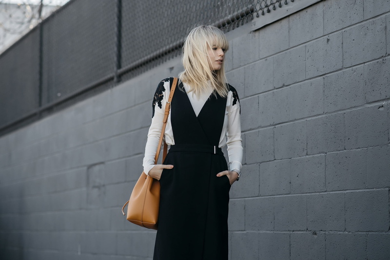 wall - building feature, contemplation, outdoors, standing, young women, blond hair, hands in pockets, women, Lisa Dengler, fashion, built structure, beauty