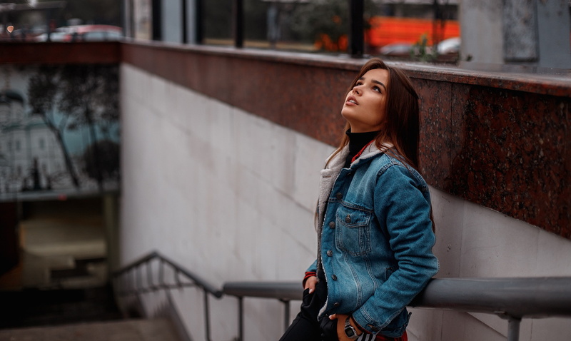 denim, black sweater, women, brunette, brown eyes, women outdoors, looking up, open mouth, portrait, 2K, hands in pockets, jeans jacket