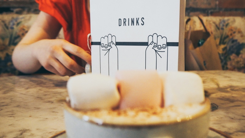 text, 4K, freshness, marshmallow, leaf on bold street, drink, table, human body part, midsection, cafe, food, hospitality, united kingdom, indoors, restaurant