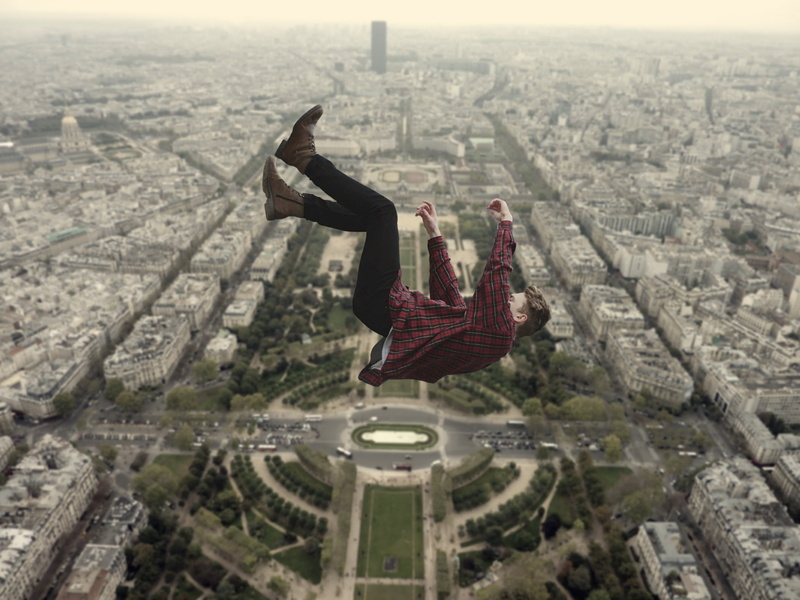 fall from the clouds, sky, building exterior, full length, cityscape, flying, nature, one person, fallen from the sky, real people, leisure activity, outdoors