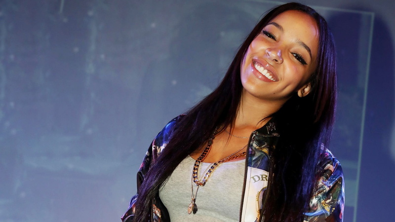 hair, one person, adult, long hair, toothy smile, hairstyle, Tinashe Kachingwe, real people, beautiful woman, looking at camera, lifestyles, purple, ebony