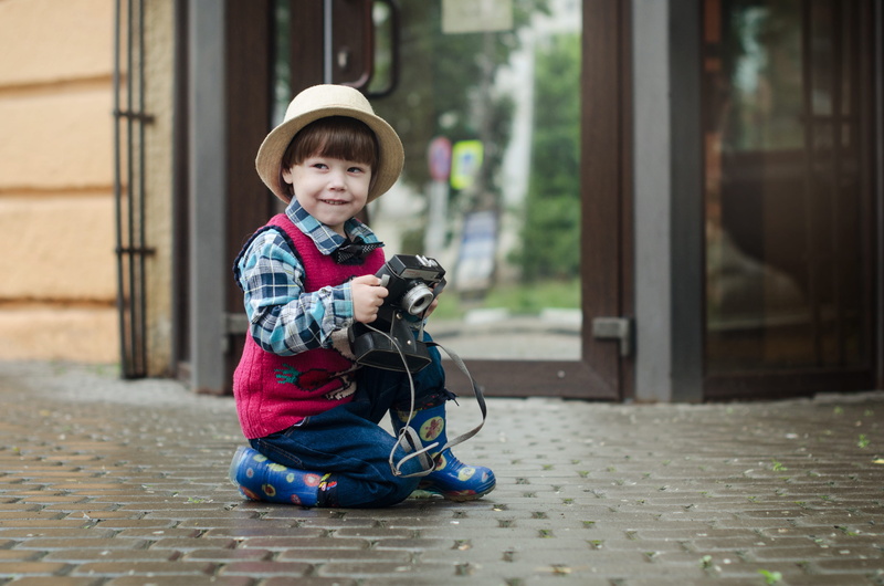 glass, young, camera, street, city, one person, outdoors, shallow, fun, childhood, full length, boy, daylight, sitting, day, focus, toddler, looking, wear