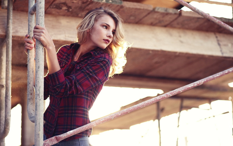 real people, standing, beautiful woman, blonde, contemplation, shorts, beauty, 2K, young women, day, shirt, railing, outdoors, architecture, women outdoors
