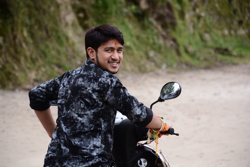 real people, focus on foreground, leisure activity, mode of transportation, land vehicle, uttarakhand, bike, one person, motorcycle, riding, road, rider
