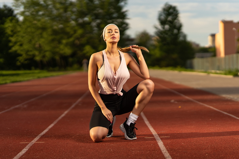 blonde, sports bra, Elena Veyron, White socks, headband, outdoors, model, socks, tank top, painted nails, sneakers, holding hair, cleavage, women, kneeling