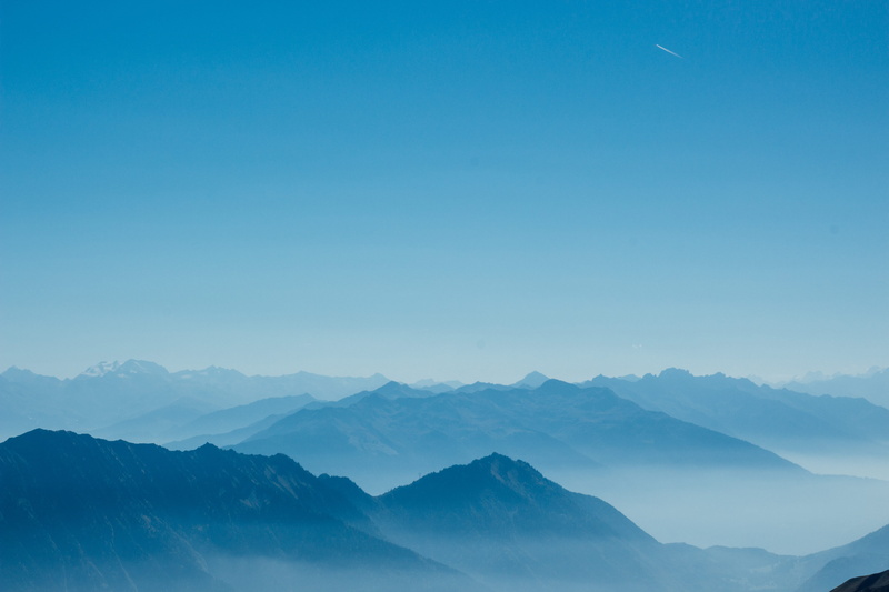 mountain layers, backgrounds, blue, outdoors, landscape, sunlight, fog, mountain, mountain Ridge, sky, hill, mountain Peak, sun, blue gradient, travel