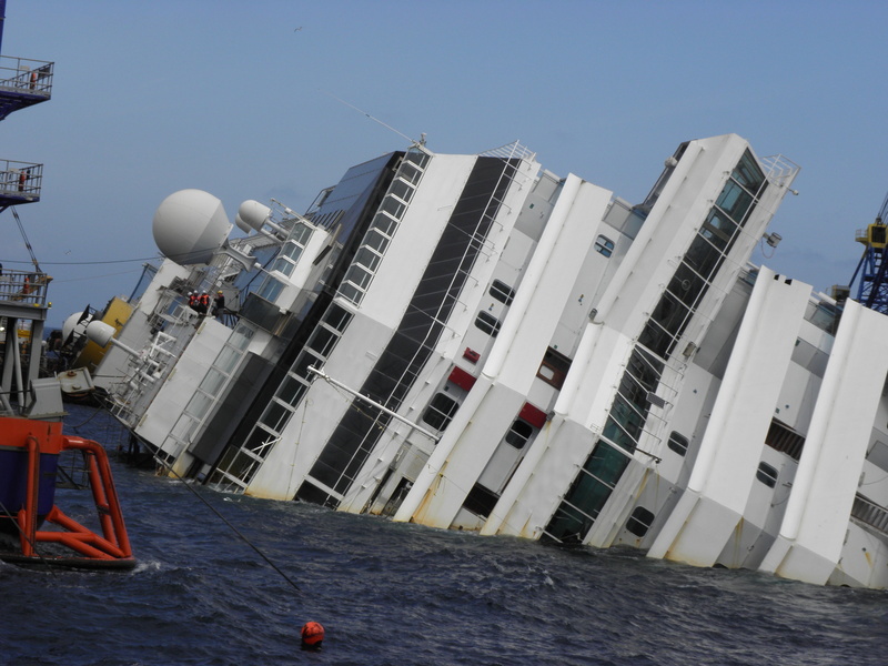 built structure, nautical vessel, day, waterfront, architecture, outdoors, sky, building exterior, sea, island, accidents and disasters, no people, ship