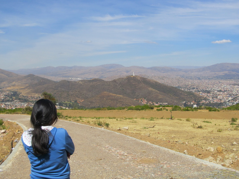 women, sky, real people, standing, hair, non-urban scene, mountain, outdoors, looking at view, scenics - nature, christ of concordia, tranquil scene, nature