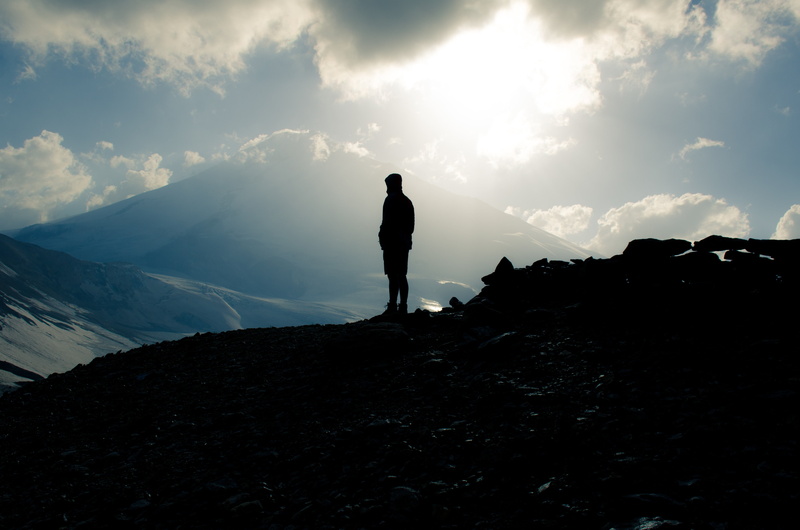nature, mount elbrus, vacations, real people, leisure activity, loneliness, russia, one person, rock - object, cloud - sky, solid, outdoors, rock, standing