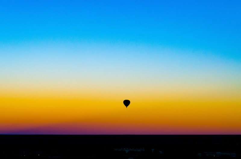 sky, no people, alone, sunlight, nature, air vehicle, silhouette, far view, sunset, transportation, tranquil scene, landscape, scenics - nature, clear sky