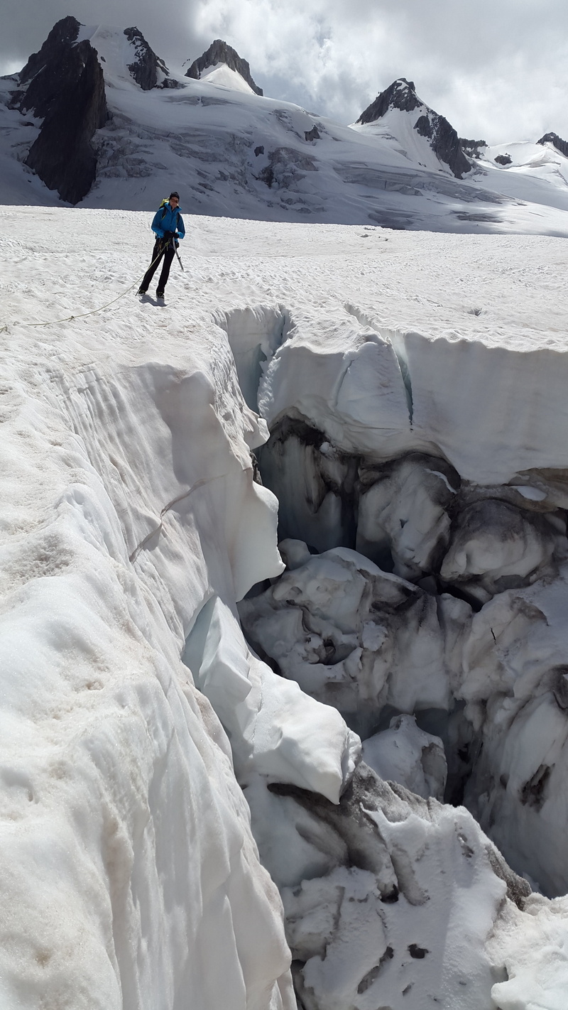 white color, beauty in nature, cold temperature, mer de glace, one person, warm clothing, snowcapped mountain, winter, hiking, full length, scenics - nature