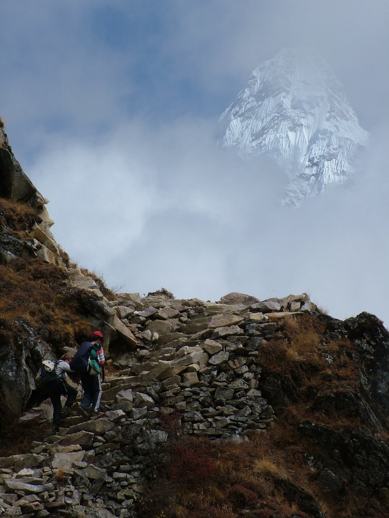 animal themes, mountain range, activity, top, way, rock, pets, sky, domestic animals, domestic, cliff, one animal, trail, landscape, rock - object, outdoors