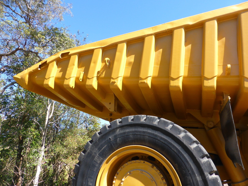 tipper, transport, outdoors, yellow, 4K, construction, truck, delivery, machine, built structure, road, sunlight, big, tire, mode of transportation, plant