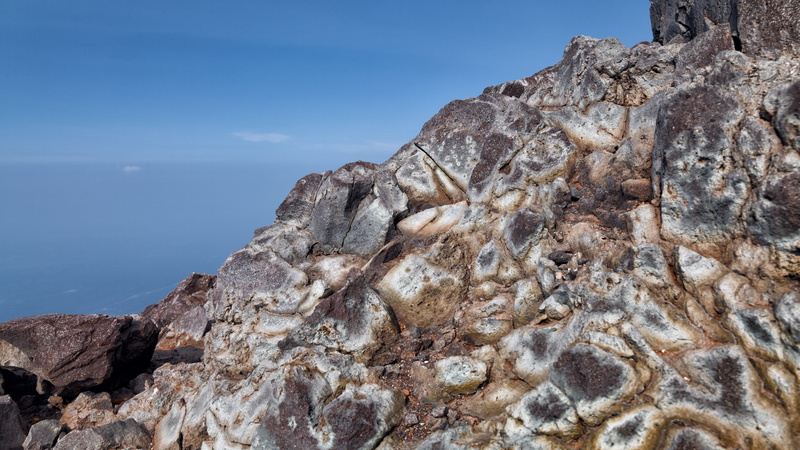 eroded, sky, physical geography, solid, rock formation, remote, day, outdoors, no people, water, geology, non-urban scene, rock, tranquil scene, land, scenics - nature